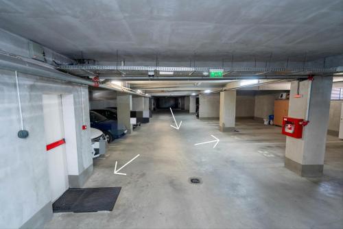 an empty parking lot in a parking garage at Hotel Studio Titan in Bucharest