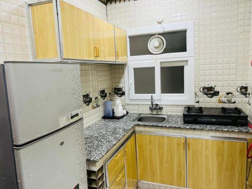Kuchyň nebo kuchyňský kout v ubytování مسارات للشقق الفندقية