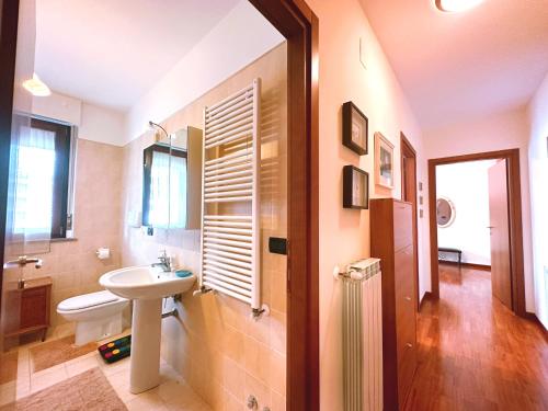 a bathroom with a sink and a mirror at La casa di Marcella in Pescara