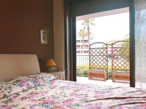 a bedroom with a bed and a large sliding glass door at La casa di Marcella in Pescara