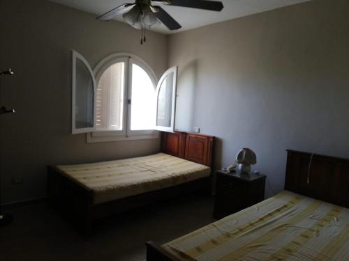 a bedroom with two beds and a window at Northern Coast - Private Resort Holiday Home in Alexandria