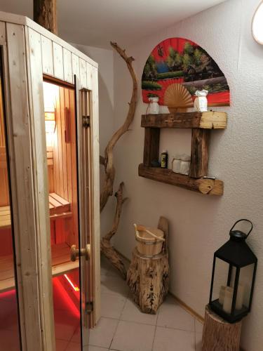 a room with a door and a mirror on the wall at Fewo Cosel Castello mit Sauna in Stolpen