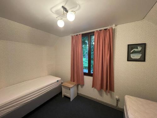 Ένα ή περισσότερα κρεβάτια σε δωμάτιο στο Финский дом в Пицунде