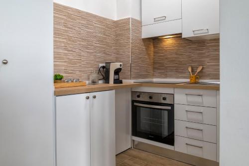 Una cocina o zona de cocina en Pufferfish Apartment with private terrace