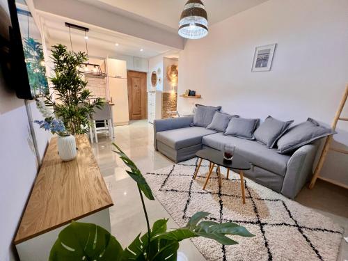 a living room with a couch and a table at Smart Holiday Cabo Negro in Cabo Negro