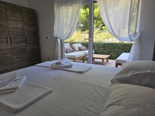 a bedroom with a bed with towels on it at Harmony suites in Bol