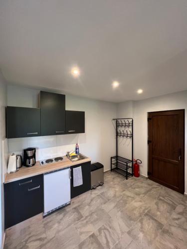 a kitchen with a sink and a counter top at FRESH Apartments in Ossiach