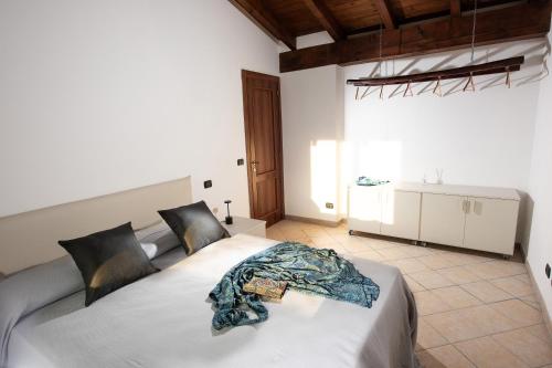 a bedroom with a large bed in a room at Il Casot Private House with Pool in Borgomale