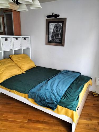 a bedroom with a large bed with at Park Studio in Oborniki Śląskie