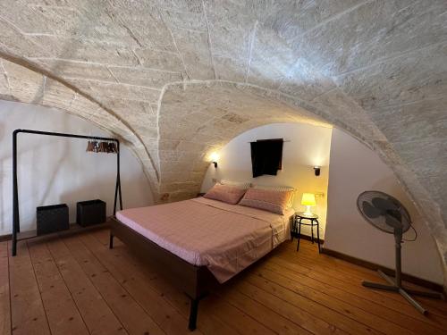 Tempat tidur dalam kamar di Casa del Fornaio