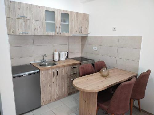 Kuchyň nebo kuchyňský kout v ubytování Garden Hill Apartment