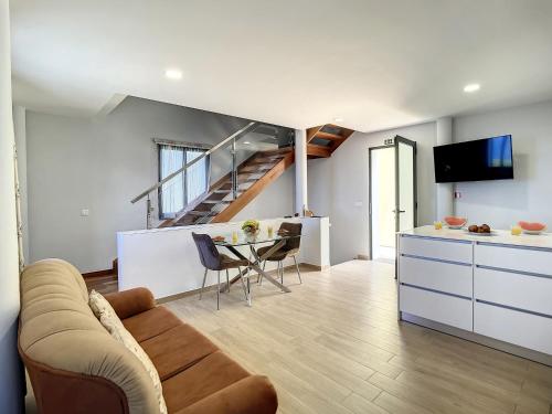 a living room with a couch and a table at My School I by Atlantic Holiday in Ponta Delgada