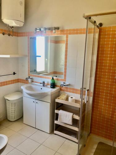 a bathroom with a sink and a shower at A View 2 Sea in Parghelia