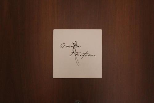 a piece of paper on a door with handwriting on it at Dimora 7 fontane in Paola