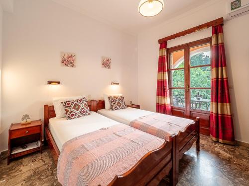 Ένα ή περισσότερα κρεβάτια σε δωμάτιο στο XENOFONTAS APARTMENTs