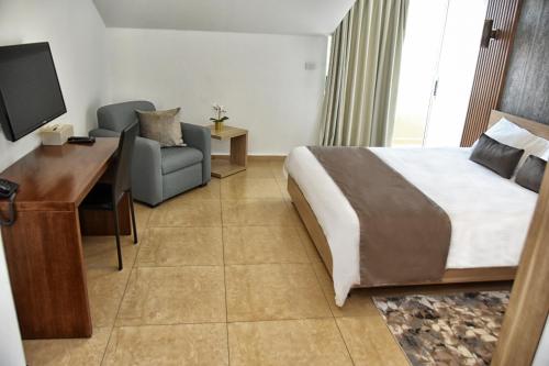 Ένα ή περισσότερα κρεβάτια σε δωμάτιο στο Byblostar Hotel