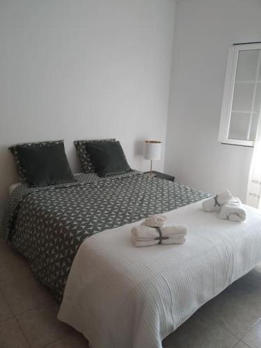 Postel nebo postele na pokoji v ubytování Apartamento em Fuseta - Casa da Praia