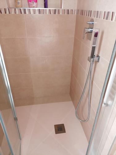 a shower in a bathroom with a glass door at Centro Storico MARE FUORI in Brindisi