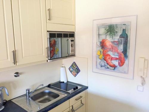 Una cocina o zona de cocina en App-Grimme-09-O