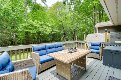 a patio with chairs and a table on a deck at Near Skiing and Hiking Gouldsboro Home with Hot Tub in Gouldsboro