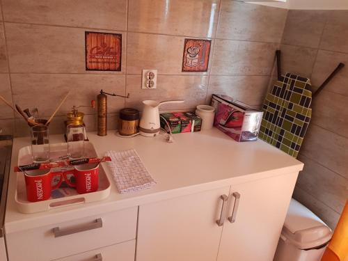 a kitchen with a counter top with cups on it at Apartmani Nina in Sarajevo