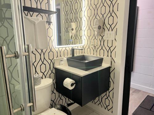 a bathroom with a sink and a toilet at The Spot in Nanaimo