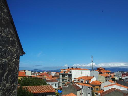 a view of a city with red roofs at HOTEL BOUTIQUE VILAVELLA in O Grove