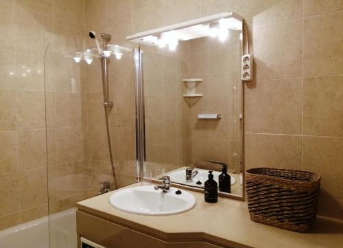 a bathroom with a sink and a shower at Nalu House Baleal - by the beach in Baleal