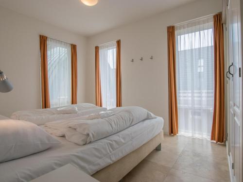 Postel nebo postele na pokoji v ubytování Krab aan Zee