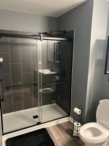 a bathroom with a shower and a toilet at Beautiful Home In Greenville in Greenville