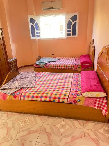 a bedroom with two beds in a room at 12 S in El Alamein