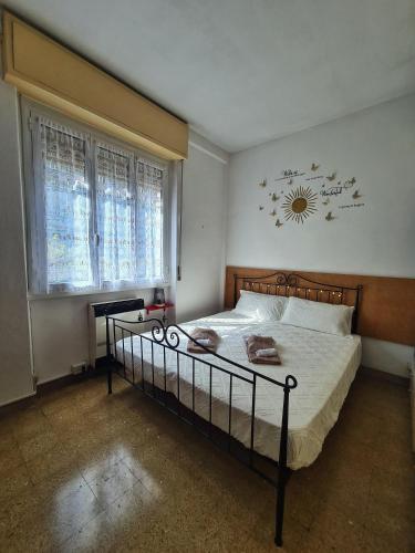 a bedroom with a bed and a clock on the wall at Il Posticino Di Bellagio in Civenna