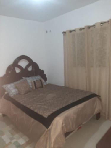 Postel nebo postele na pokoji v ubytování CONDO EN SANTO DOMINGO