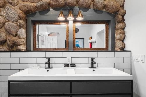 a bathroom with a white sink and a mirror at The Creekstone in Idyllwild
