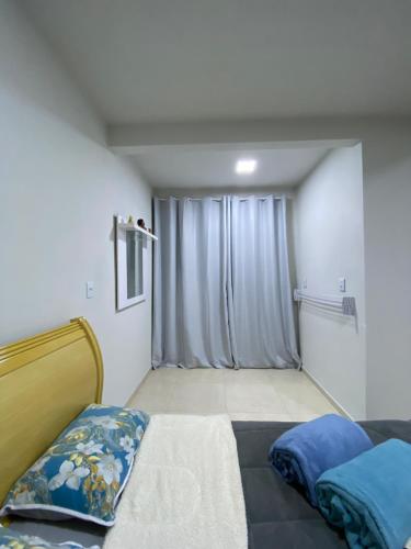 Кровать или кровати в номере Apartamento Fruto da Terra 303