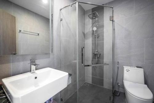 a bathroom with a sink and a shower and a toilet at Ocean Grove Pool Villa - Koh Chang in Ko Chang