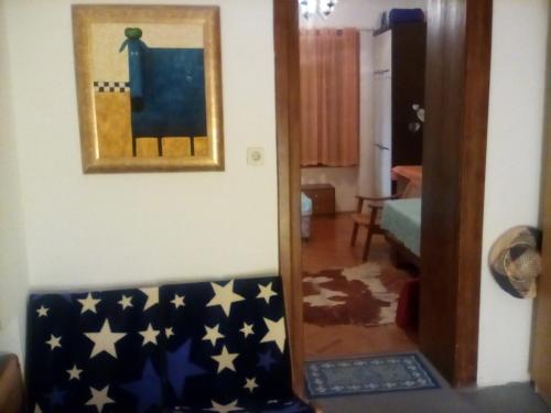 a living room with an american flag blanket on a couch at Apartman MICHI in Sveti Juraj