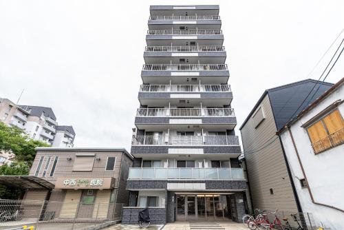 a tall building with balconies on the side of it at H2H OsakaCastle in Osaka