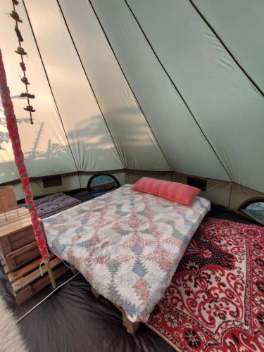 a bedroom with a bed in a tent at Camping Kromidovo in Kromidovo
