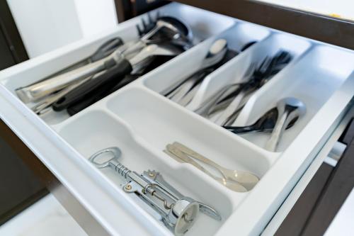 a drawer filled with utensils in a kitchen at Villa Paramount 1 in Nakhon Nayok