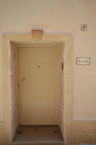 a garage door in a room with a brick wall at Maison de luxe in Francavilla Fontana
