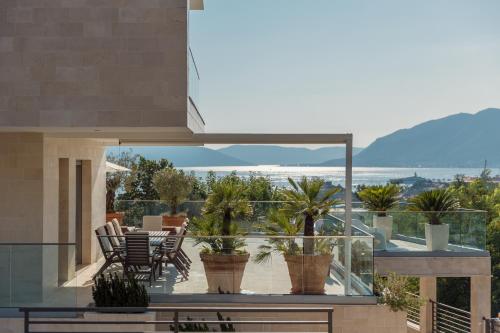 a view from the balcony of a house with plants at Villa Roc Blanc in Tivat