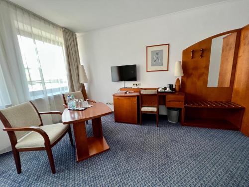 TV a/nebo společenská místnost v ubytování City Hotel