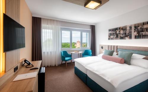 Posteľ alebo postele v izbe v ubytovaní Hunguest Hotel Gyula