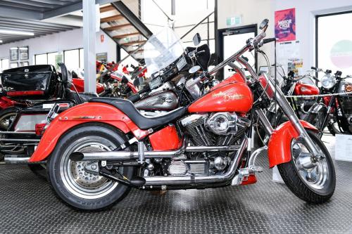 a red motorcycle is parked in a garage at Powerhouse Hotel Tamworth by Rydges in Tamworth