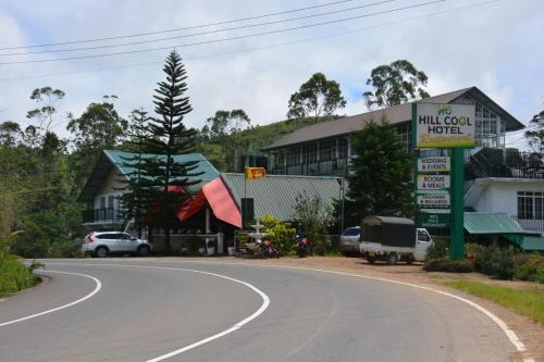 a winding road in front of a building at Hill Cool Hotel & Restaurant in Hatton