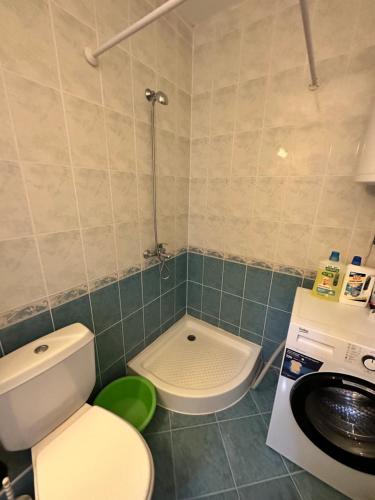 a bathroom with a toilet and a washing machine at Summer Dreams B26 in Sunny Beach