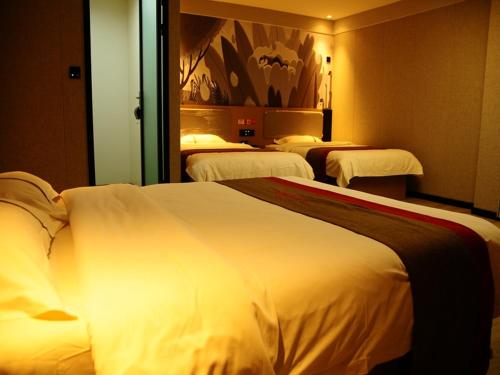 Postelja oz. postelje v sobi nastanitve Thank Inn Chain Hotel Hebei Shijiang Yecheng West Lianzhou Road