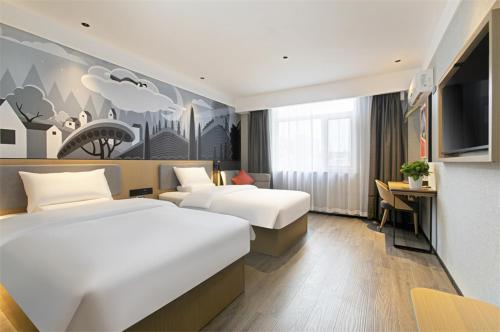 a hotel room with two beds and a desk at Thank Inn Chain Hotel Shanxi Yangquan Yu County West Xiushui Street in Yu