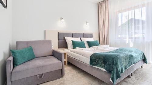 Tempat tidur dalam kamar di Apartamenty Sun & Snow Family Dominikana Resort & SPA